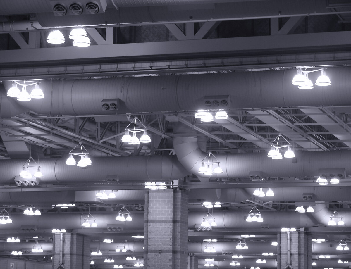 Overhead commercial light fittings in a large industrial building