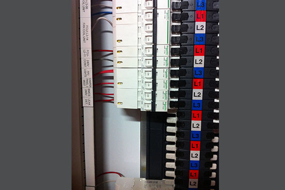 Three phase distribution board with labelled circuit breakers