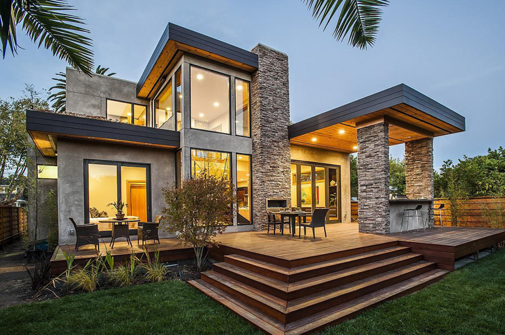 Modern home lit up at dusk