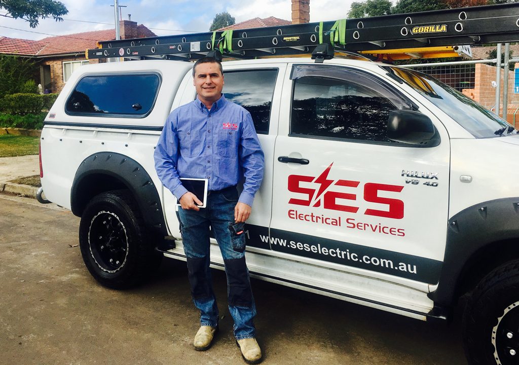 Paul standing beside the SES Electrical Services ute